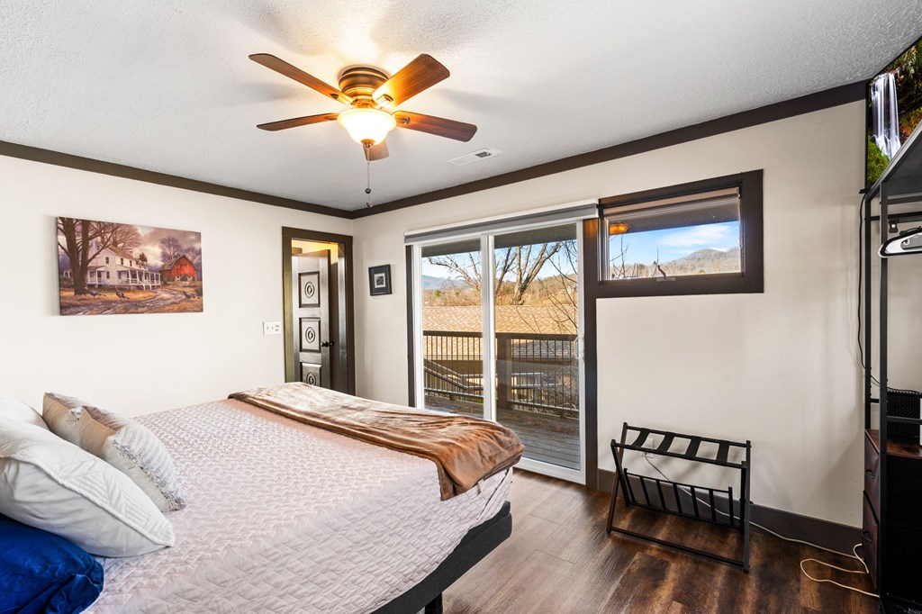 314 Kilpatrick Point Drive Hayesville, NC 28904 - Photo 21 of 50 a bedroom with a large bed and a window