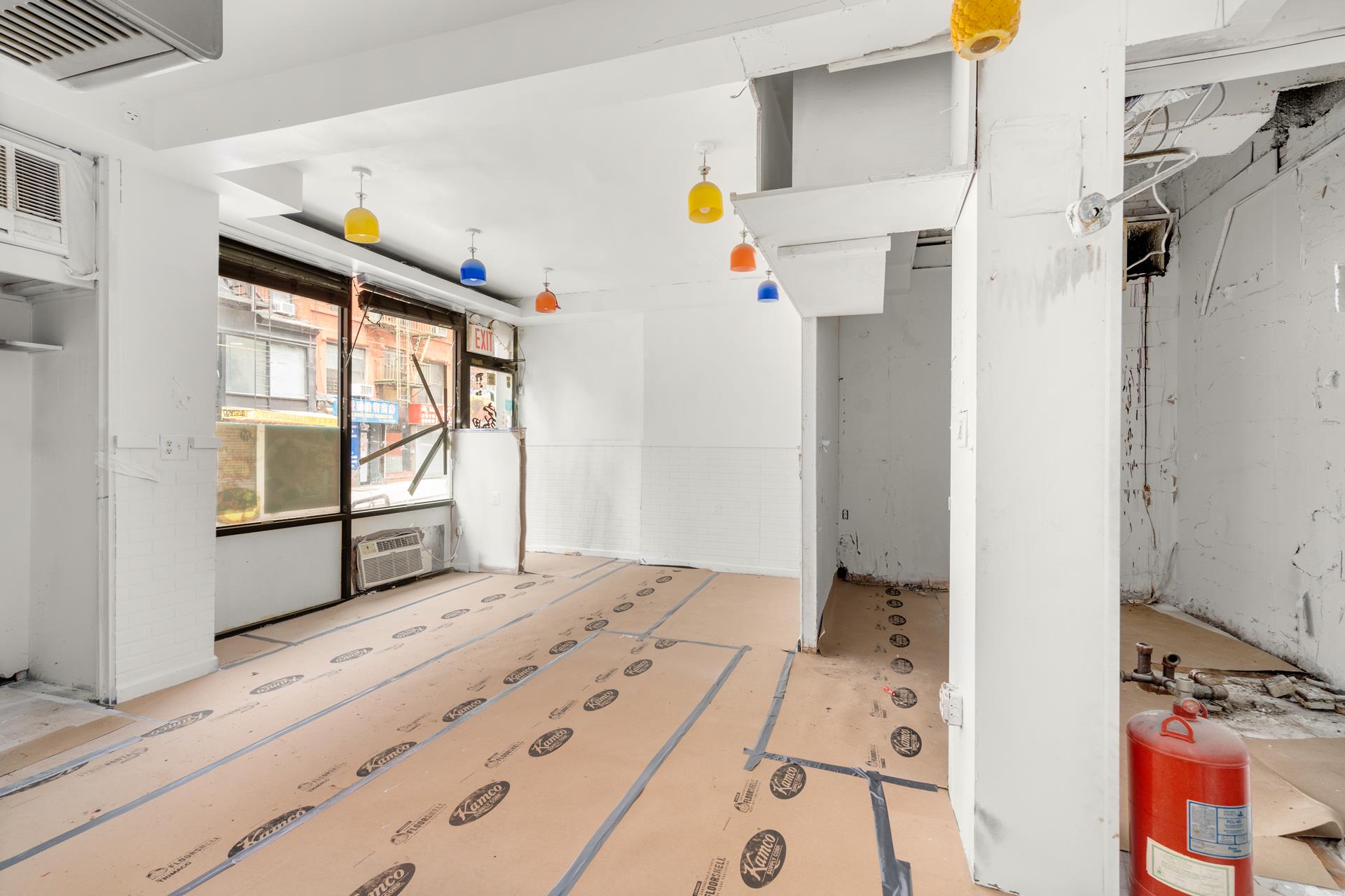 2 Eldridge Street Manhattan, NY 10002 - Photo 5 of 11 a bedroom with a bed and a window