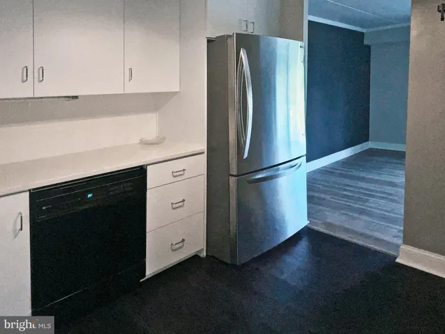 a kitchen with appliances and cabinets