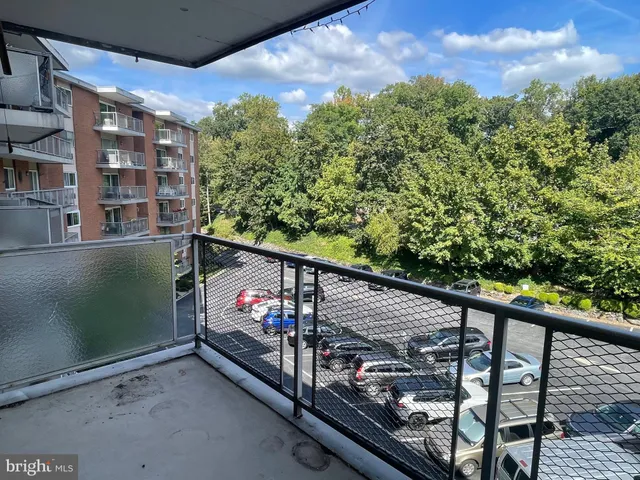 a view of a balcony with chairs