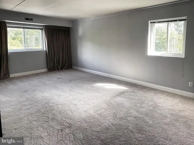 an empty room with windows