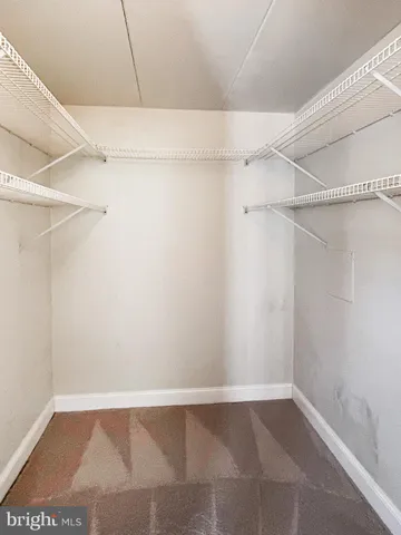 a view of an empty walk in closet