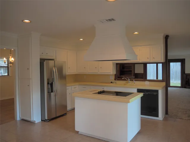 a view of a room that has a large window