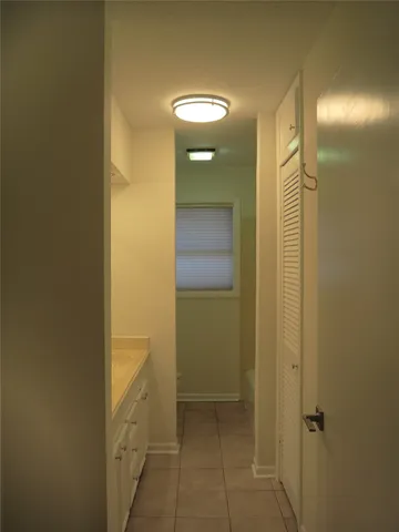 a view of a backyard with large trees