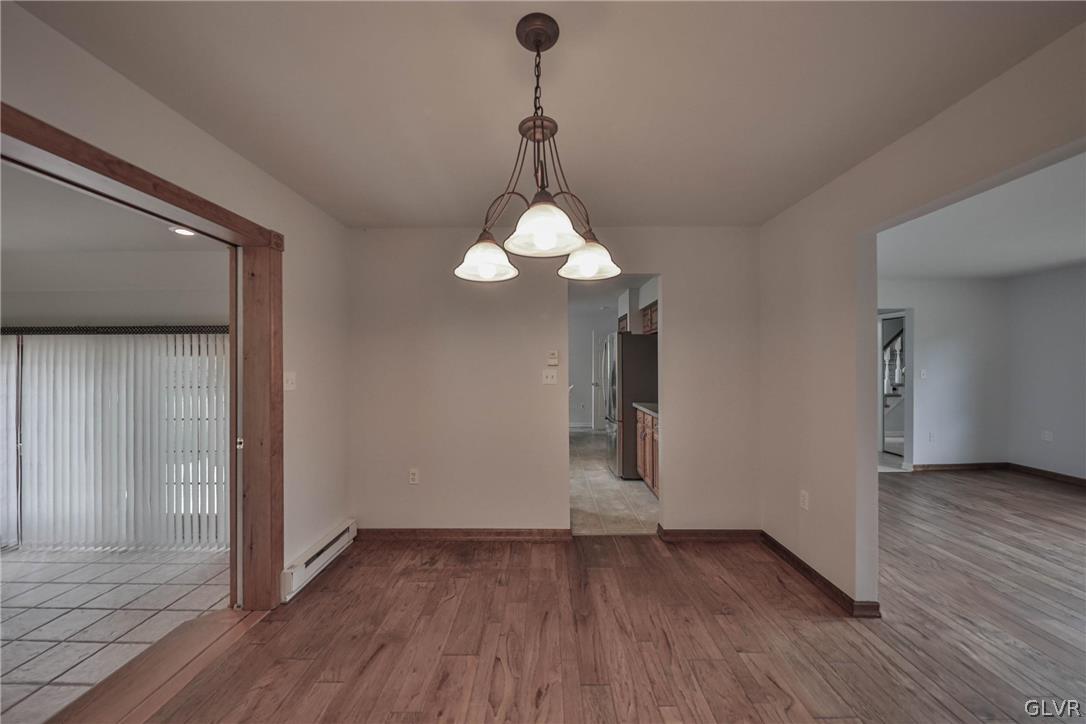 4682 Ash Drive Nazareth, PA 18064 - Photo 11 of 40 a view of a room with wooden floor and chandelier