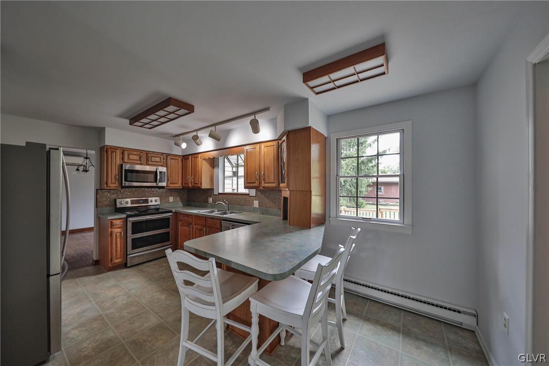 4682 Ash Drive Nazareth, PA 18064 - Photo 29 of 40 a kitchen with a table and chairs