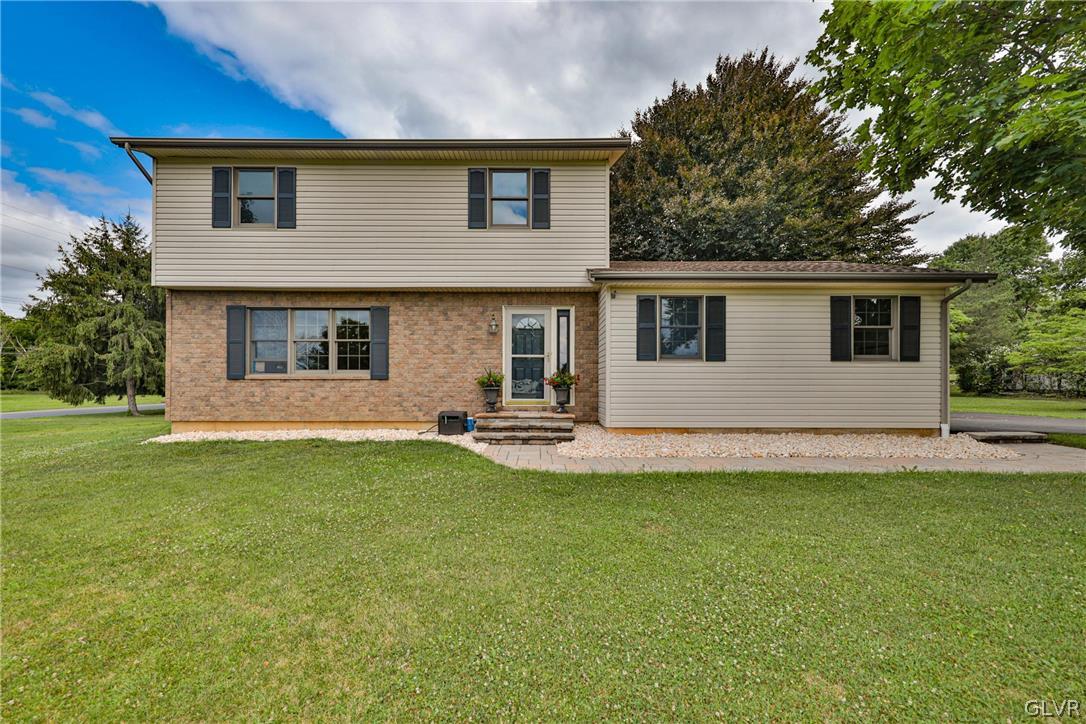 4682 Ash Drive Nazareth, PA 18064 - Photo 3 of 40 a house that has a big yard in front of it