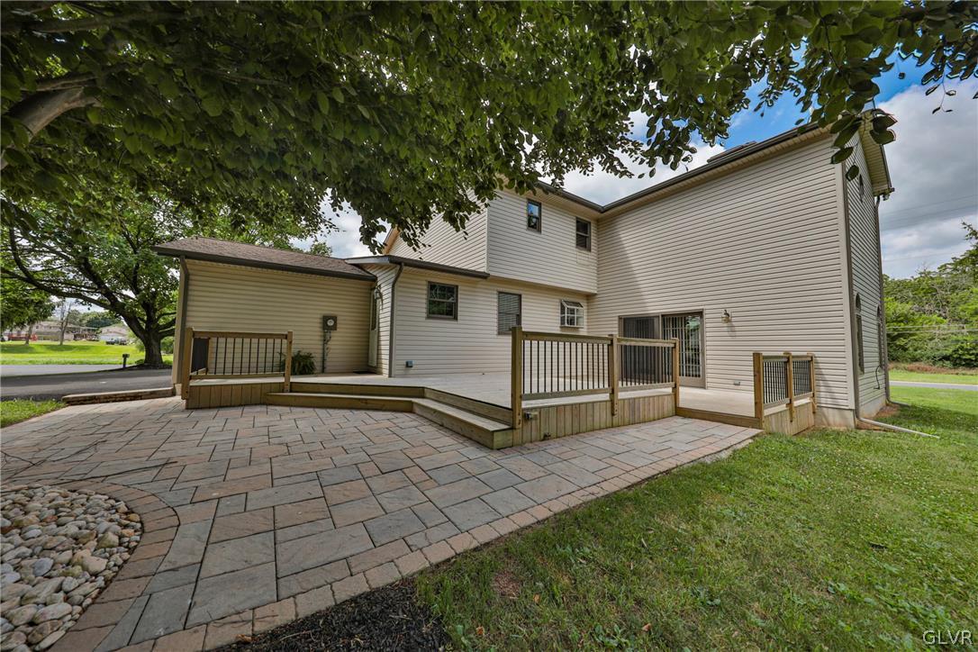 4682 Ash Drive Nazareth, PA 18064 - Photo 36 of 40 a view of a backyard with a garden and tree