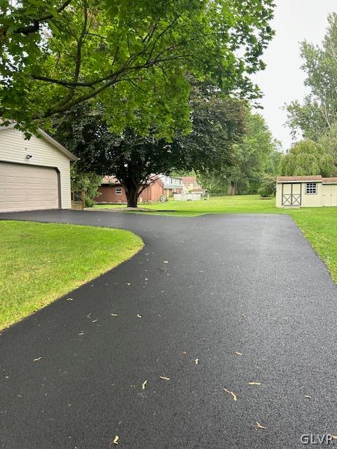 4682 Ash Drive Nazareth, PA 18064 - Photo 39 of 40 a view of a house with a yard and a large tree