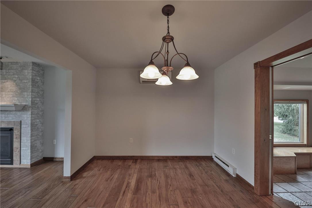 4682 Ash Drive Nazareth, PA 18064 - Photo 10 of 40 a view of a room with wooden floor and chandelier