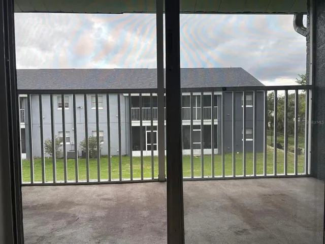 a view of a garden from a balcony