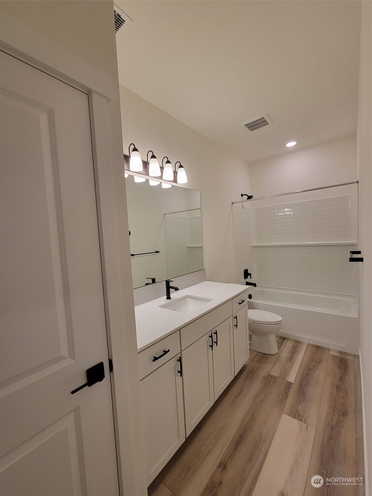 3545 Edith Avenue, Unit 28 Enumclaw, WA 98022 - Photo 4 of 10 a bathroom with a double vanity sink and mirror with shower