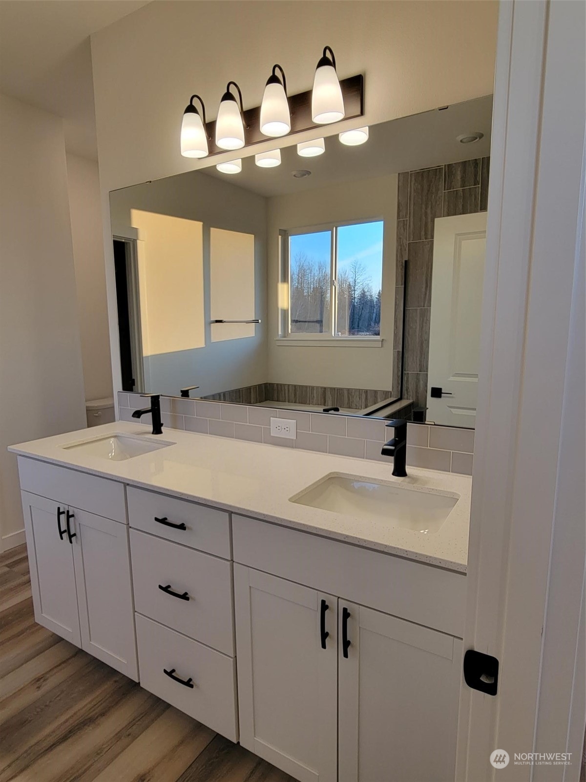 3545 Edith Avenue, Unit 28 Enumclaw, WA 98022 - Photo 8 of 10 a bathroom with a sink and a mirror
