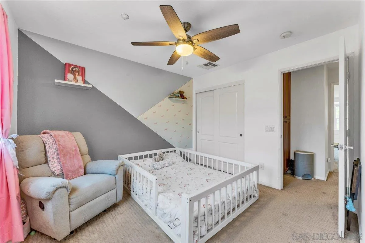 76 Via Sovana Santee, CA 92071 - Photo 11 of 34 a bed room with a bed and a couch