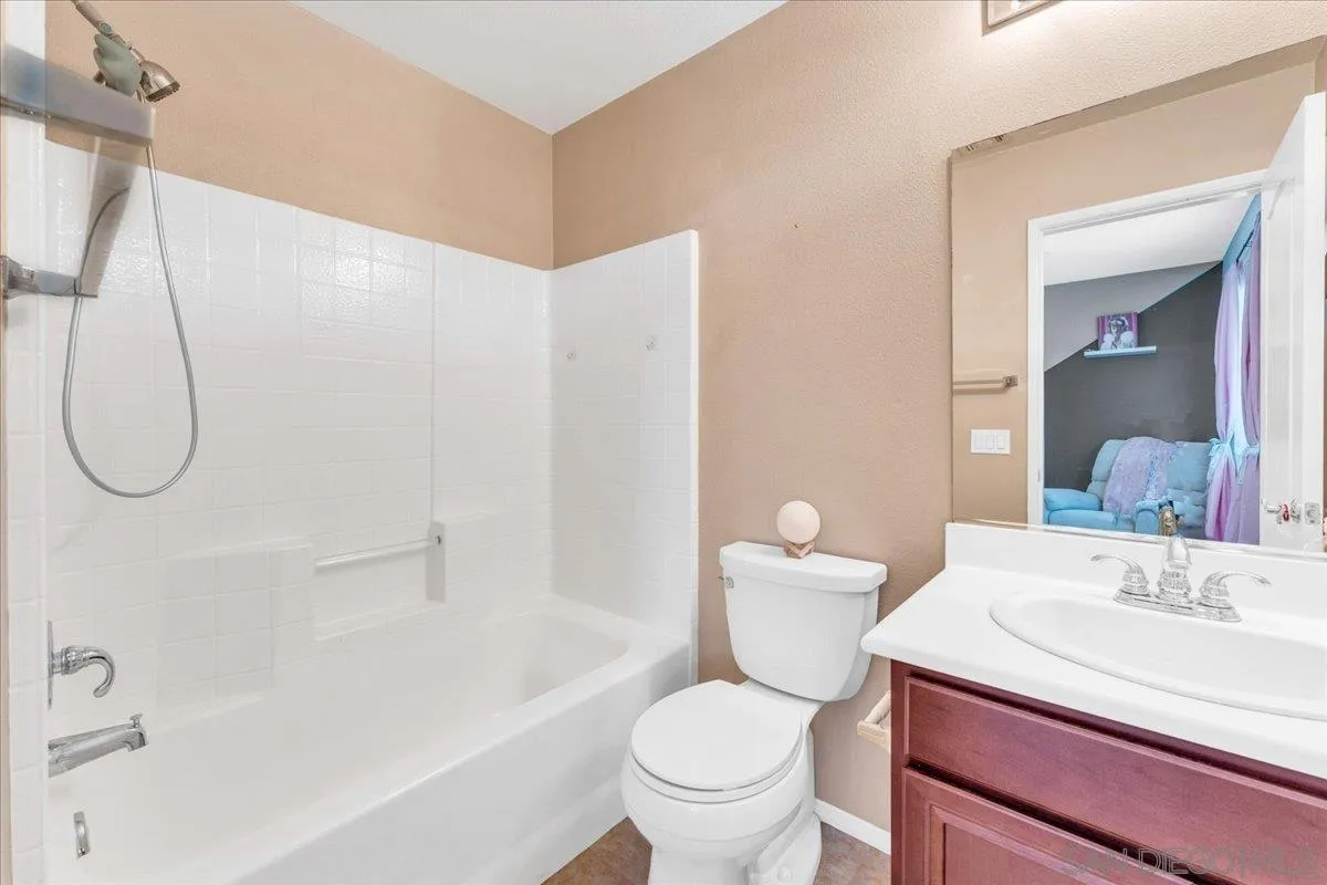76 Via Sovana Santee, CA 92071 - Photo 12 of 34 a bathroom with a sink toilet and shower