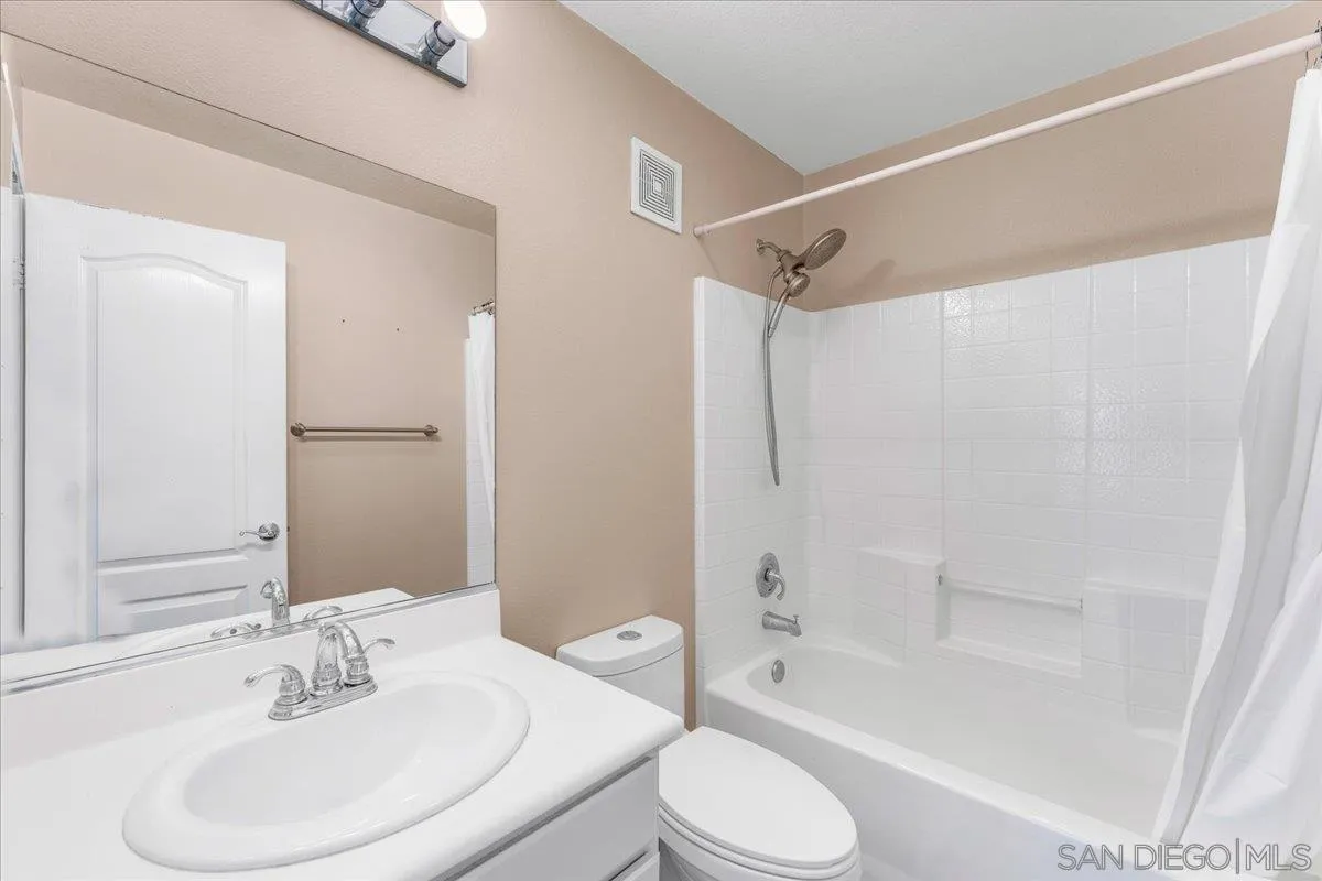 76 Via Sovana Santee, CA 92071 - Photo 23 of 34 a bathroom with a sink toilet and shower