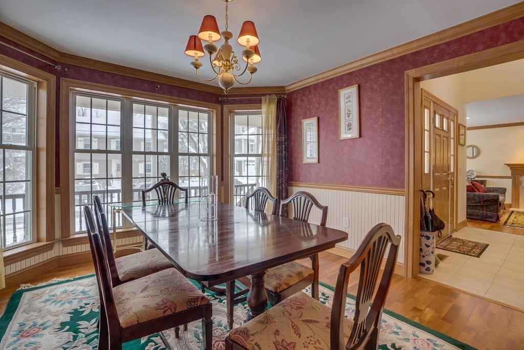 265 Renfrew Street Arlington, MA 02476 - Photo 16 of 39 a view of a dining room with furniture window and wooden floor