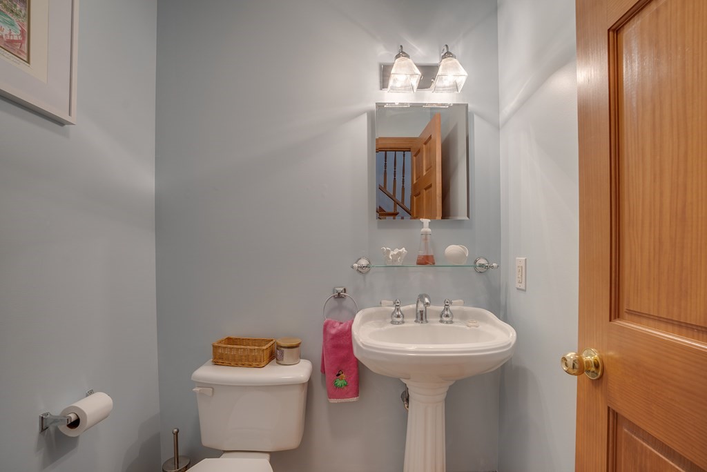 265 Renfrew Street Arlington, MA 02476 - Photo 18 of 39 a bathroom with a sink and mirror with toilet