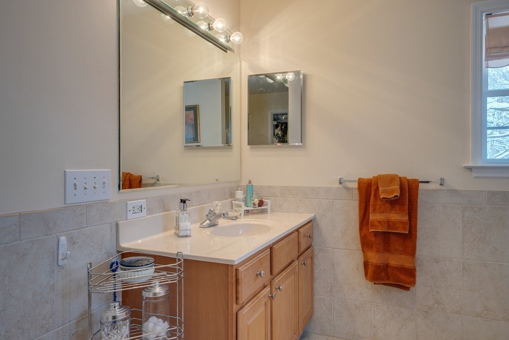 265 Renfrew Street Arlington, MA 02476 - Photo 25 of 39 a bathroom with a sink and a mirror
