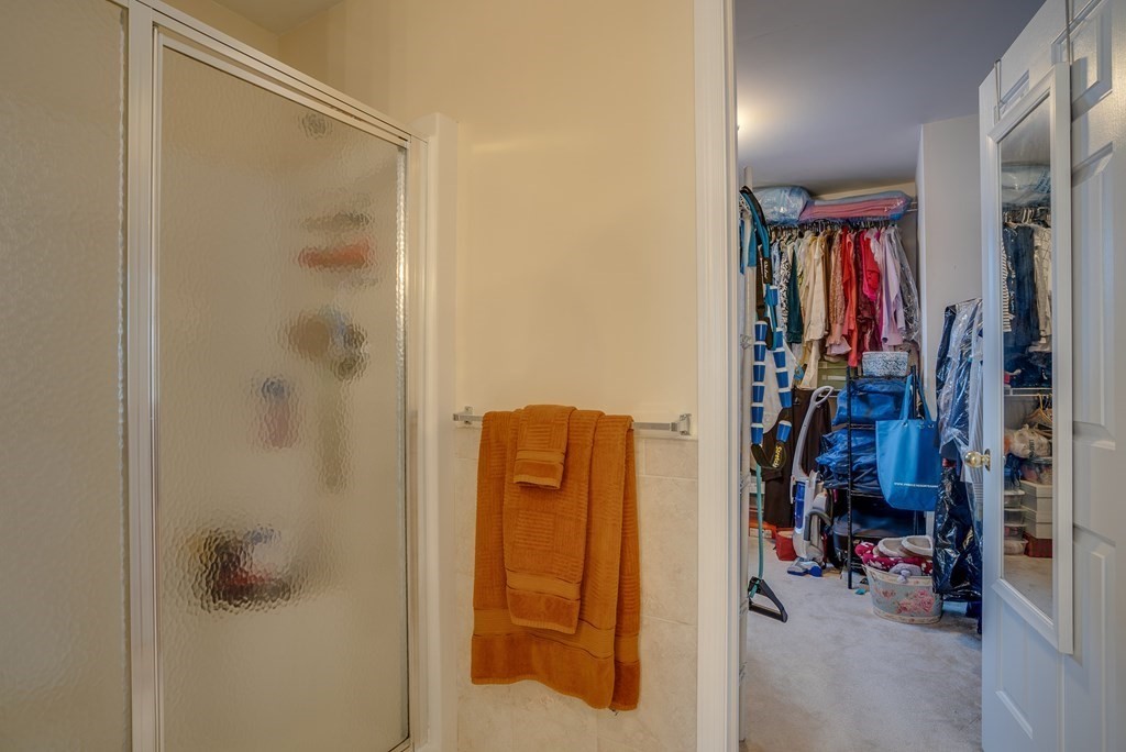 265 Renfrew Street Arlington, MA 02476 - Photo 26 of 39 a view of walk in closet with clothes and shoes