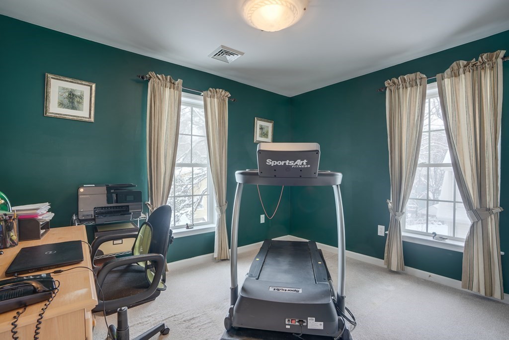 265 Renfrew Street Arlington, MA 02476 - Photo 31 of 39 a room with furniture and a window
