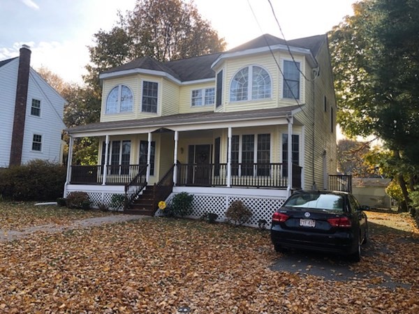 265 Renfrew Street Arlington, MA 02476 - Photo 37 of 39 a front view of a house with a garden