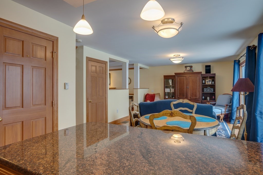 265 Renfrew Street Arlington, MA 02476 - Photo 8 of 39 a room with furniture and a chandelier