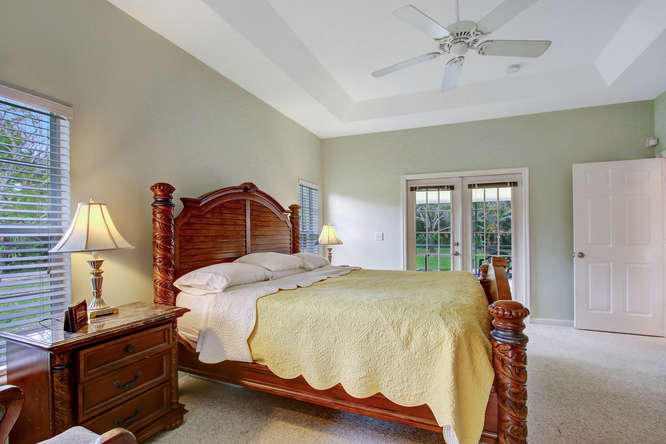 9481 154th Road North Jupiter, FL 33478 - Photo 16 of 32 Master suite view to covered patio