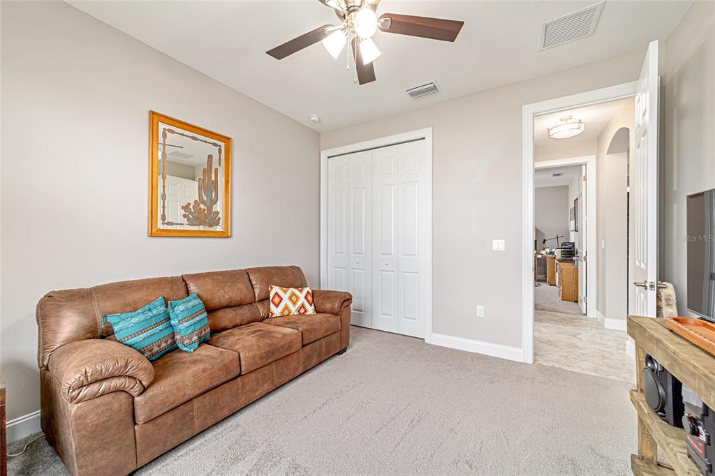 1983 Northwest 79th Loop Ocala, FL 34475 - Photo 45 of 97 a living room with furniture and a chandelier