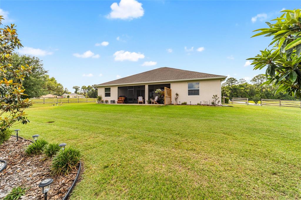 1983 Northwest 79th Loop Ocala, FL 34475 - Photo 94 of 97 a view of a house with a big yard