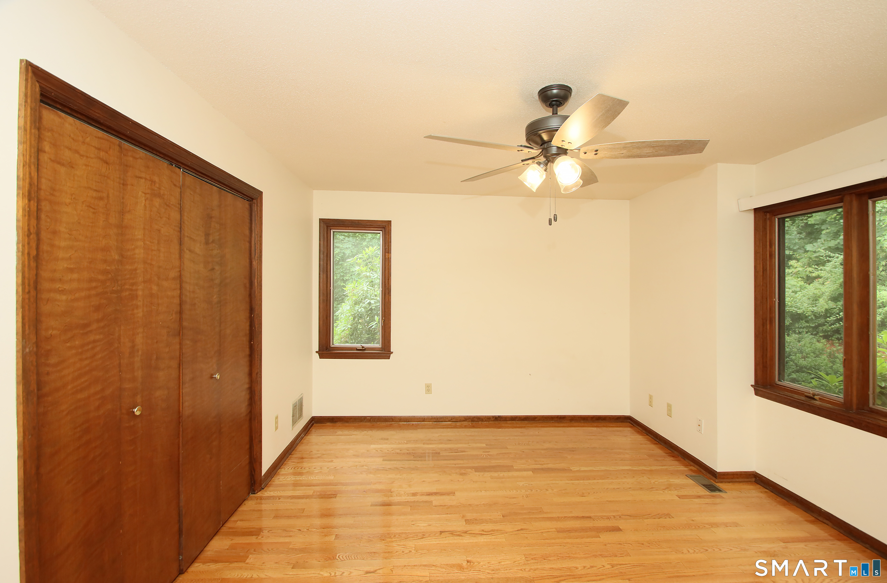 352 Center Street Wolcott, CT 06716 - Photo 25 of 40 a view of an empty room with window and a ceiling fan