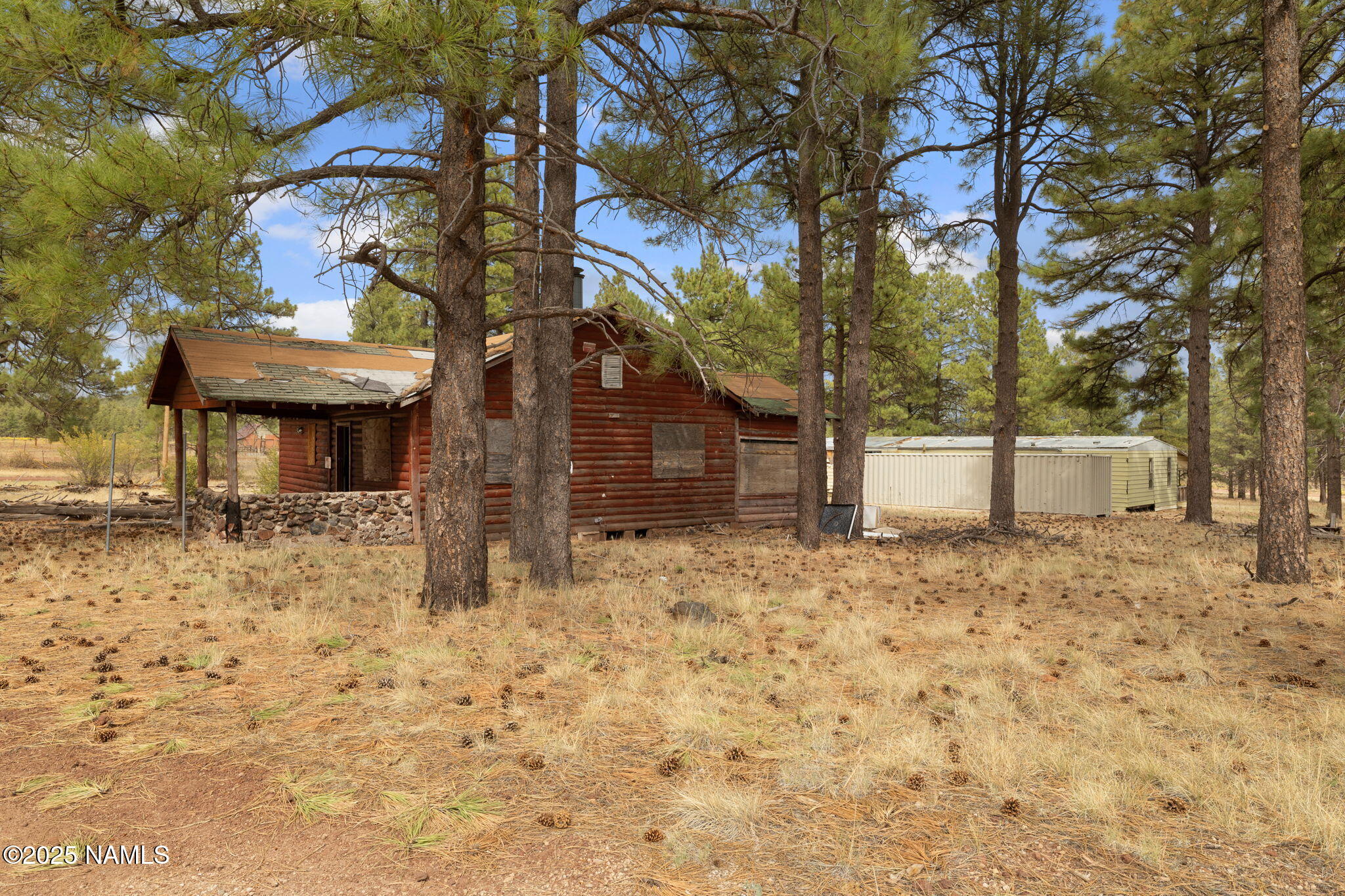 630 Cooper Ranch Road Williams, AZ 86046 - Photo 21 of 33 a view of a house with a tree