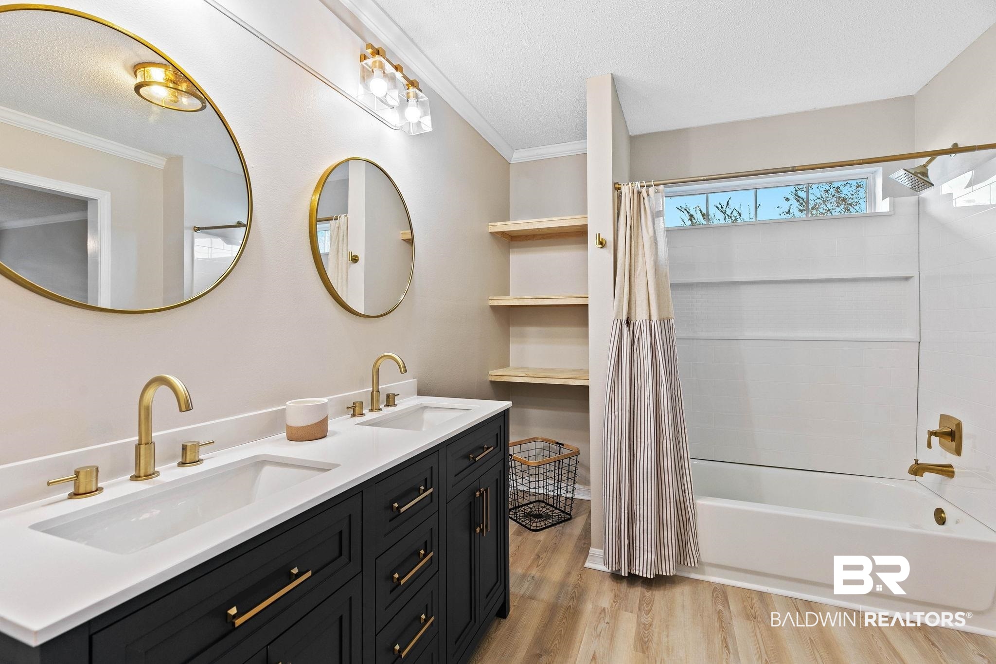 35650 Spring Road North Stapleton, AL 36578 - Photo 39 of 70 Bathroom with shower / bath combo with shower curtain, ornamental molding, light wood-type flooring, and double vanity