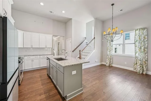 a view of a small space with wooden floor and a window