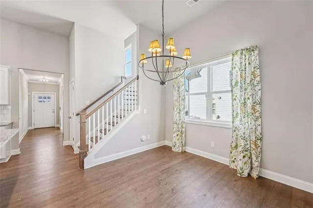 a bathroom with a double vanity sink a mirror a shower and a bathtub