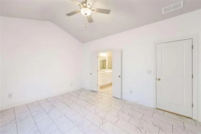 a bathroom with a shower sink vanity and a mirror