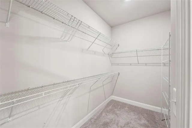 a view of a chair and table in the backyard