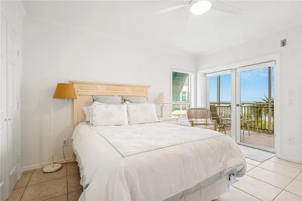 a bedroom with a large bed and a table