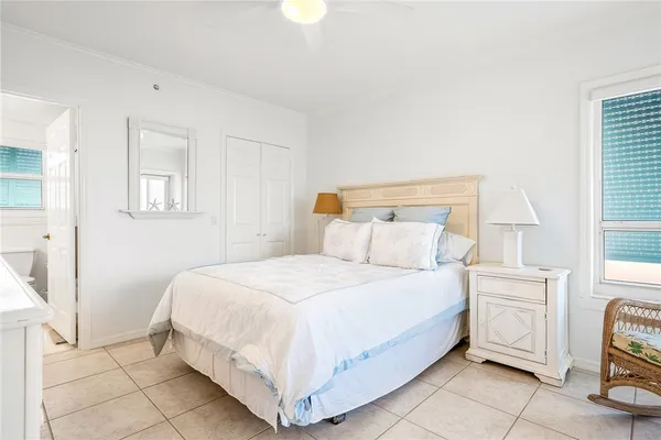 a bedroom with a bed and a tv