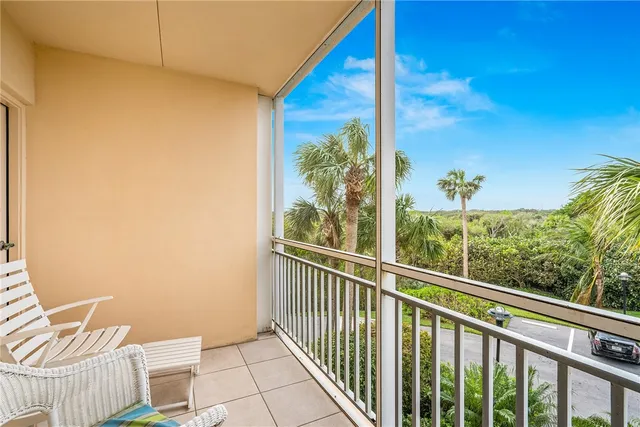 a view of a balcony with chair