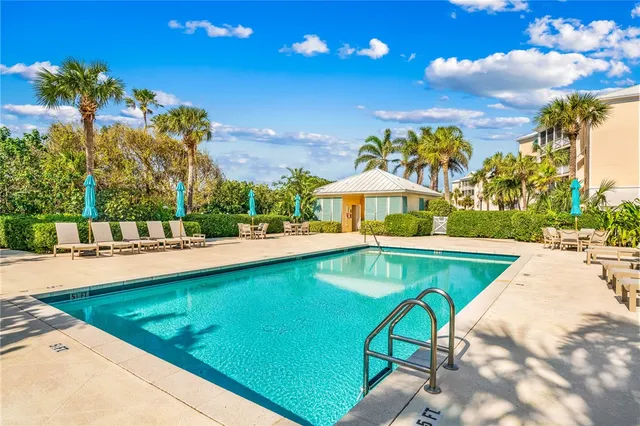 a view of swimming pool and outdoor seating