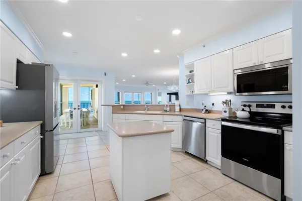 a kitchen with counter top space appliances and cabinets