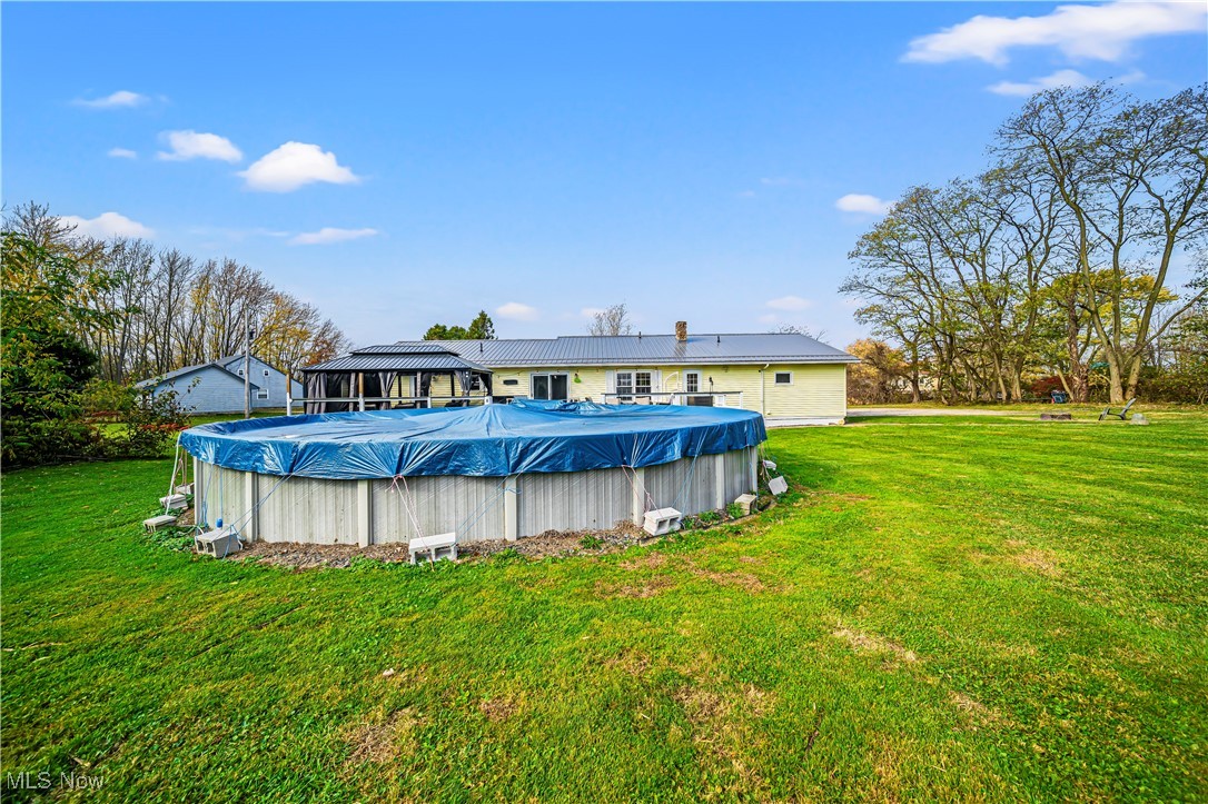 4188 State Road South Ashtabula, OH 44004 - Photo 34 of 46 View of swimming pool featuring a lawn