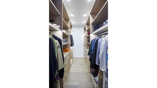 a bathroom with a double vanity sink mirror and bathtub
