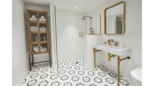 a bedroom with a bed furniture and paintings on the wall