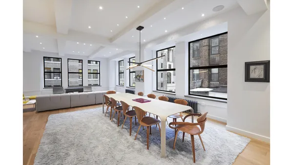 a living room with furniture and a rug