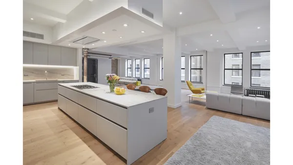 a living room with furniture and a table