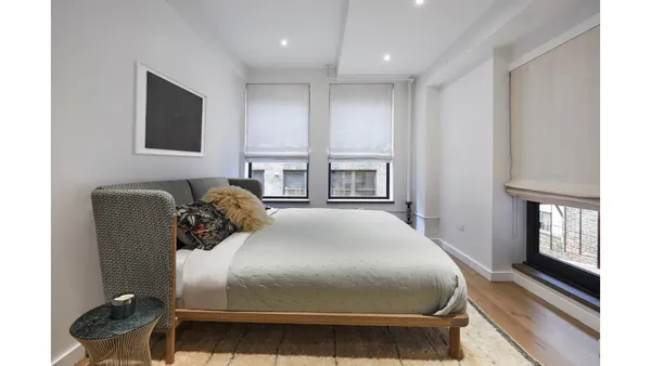 a kitchen with a table and chairs