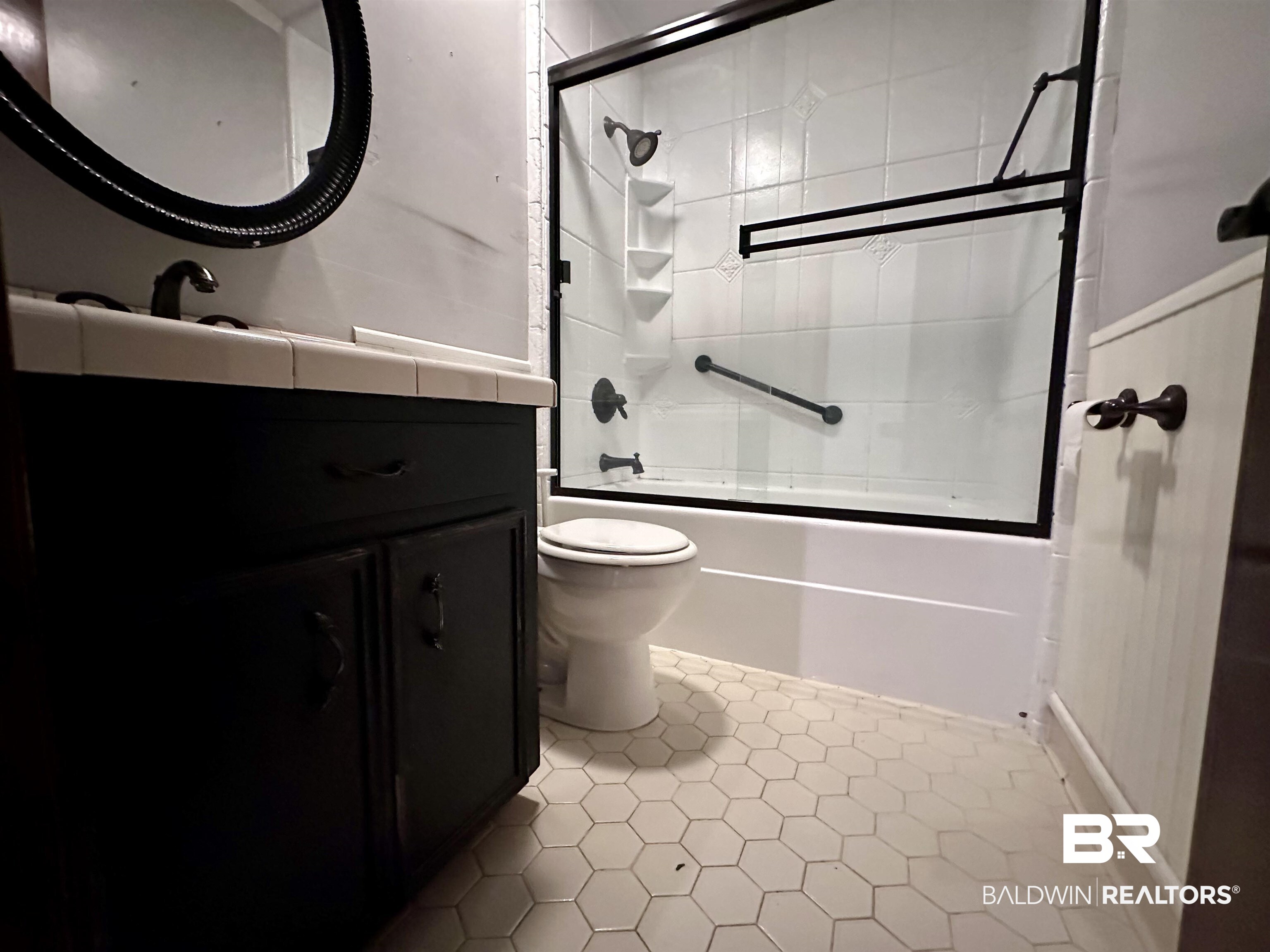 3613 Vista Ridge Drive Mobile, AL 36693 - Photo 6 of 9 Full bathroom with vanity, tile patterned flooring, enclosed tub / shower combo, and toilet