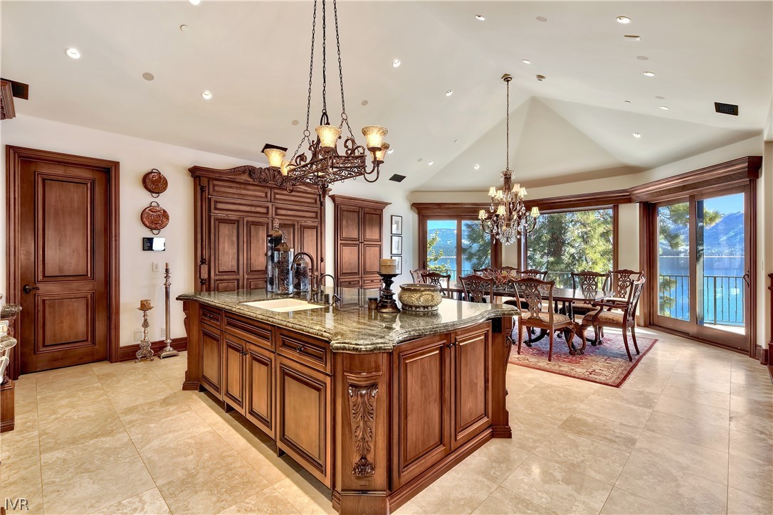 32 Crystal Drive Crystal Bay, NV 89402 - Photo 11 of 35 a kitchen with stainless steel appliances granite countertop a stove and a dining table with chairs